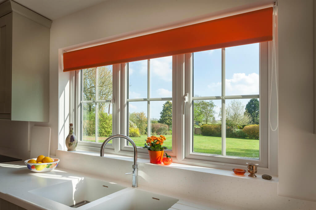 White aluminium casement windows in a kitchen behind the sink in the UK