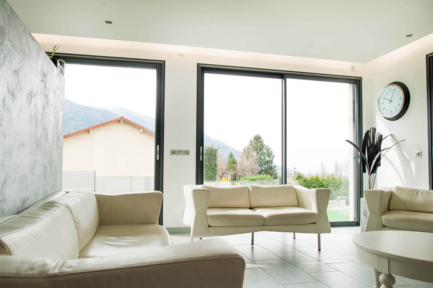 AluK lift and slide doors in a white living room