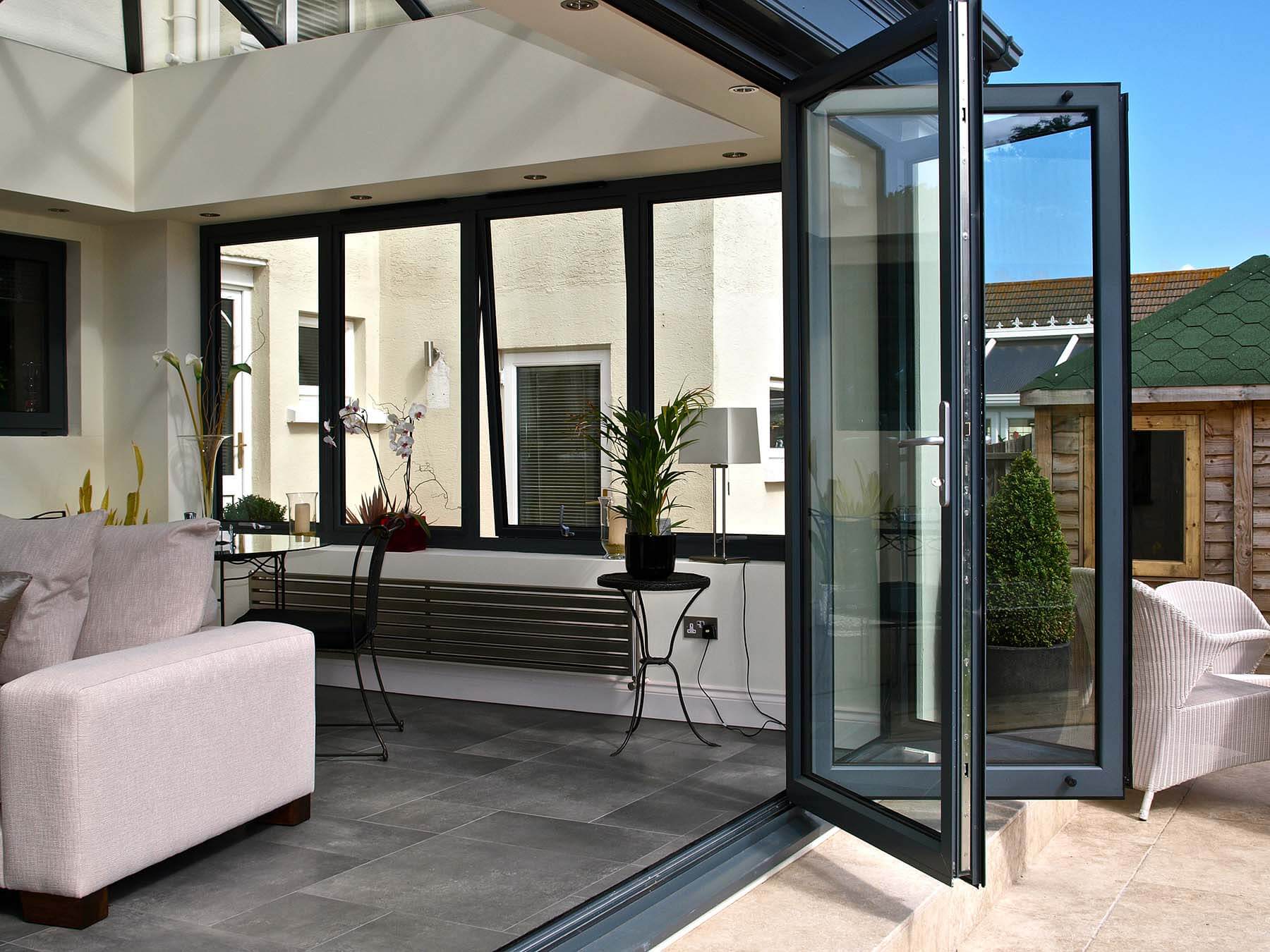 AluK aluminium bifold doors open