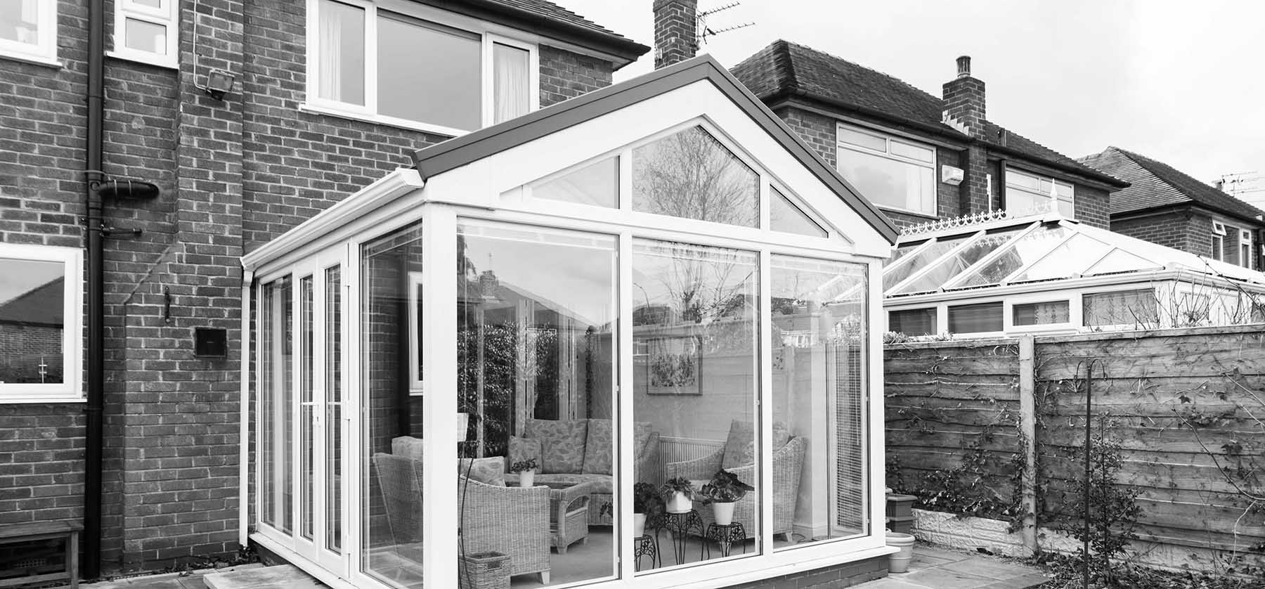 Classic Conservatory in black and white within a garden